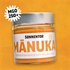 SONNENTOR MÁNUKA Bio-Blütenhonig aus Neuseeland im Glas mit silbernem Deckel und dem Icon "MGO 250+" auf orangem Hintergrund.