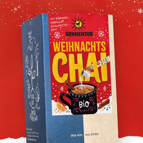 SONNENTOR organic Christmas Chai packaging with text "Christmas Chai", "organic" and "with orange granules, black tea & cinnamon"