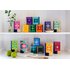 In the picture you can see all tea packs of the Happiness Is series. They are on a shelf and are distributed on two floors.